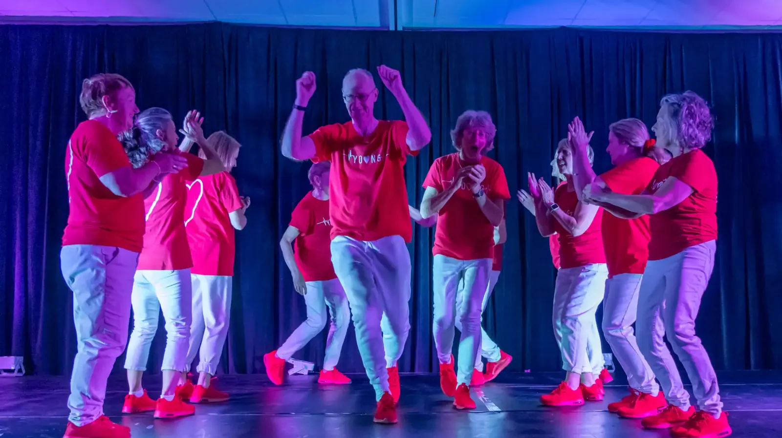 The Young at Heart 50-plus crew performing on stage