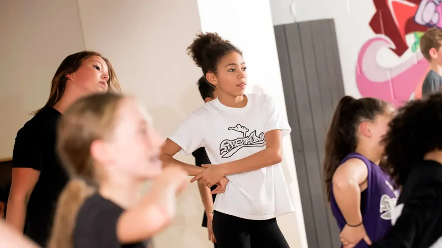 Intermediate dancers learning choreography